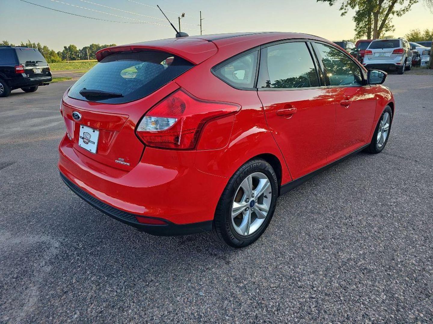 2014 RED FORD FOCUS SE (1FADP3K22EL) with an 2.0L engine, Automatic transmission, located at 495 Old Highway 20 West, South Sioux City, NE, 68776, (402) 494-2677, 42.458408, -96.443512 - Photo#1