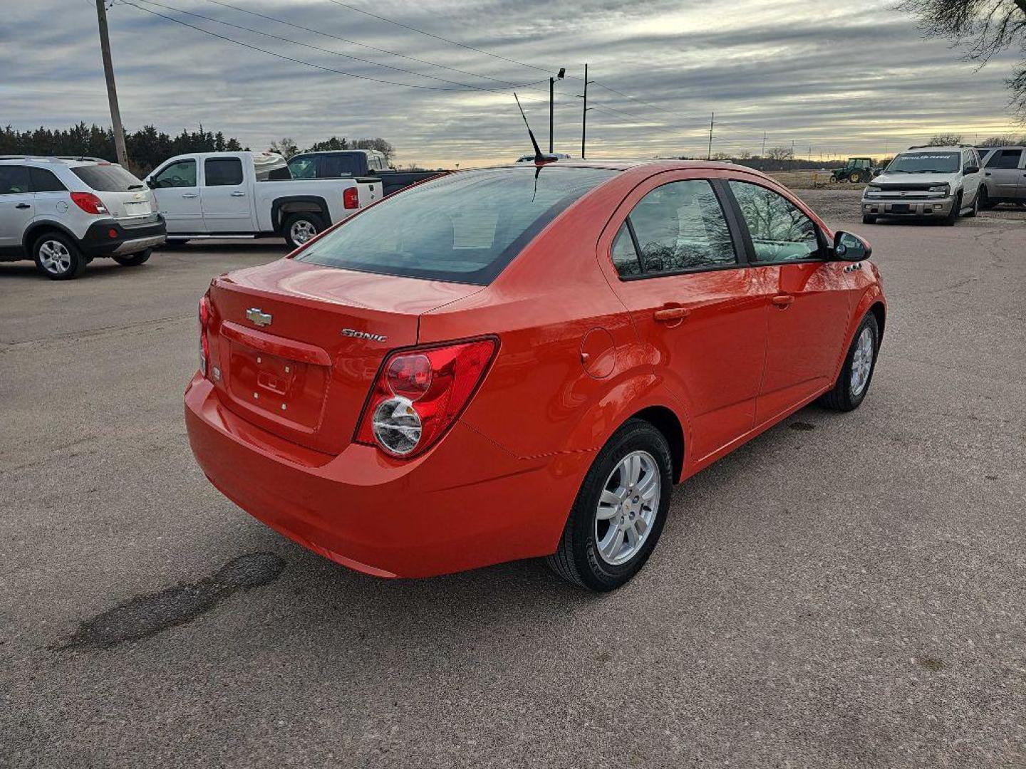 2012 ORANGE CHEVROLET SONIC LS (1G1JA5SHXC4) with an 1.8L engine, Automatic transmission, located at 495 Old Highway 20 West, South Sioux City, NE, 68776, (402) 494-2677, 42.458408, -96.443512 - Photo#3